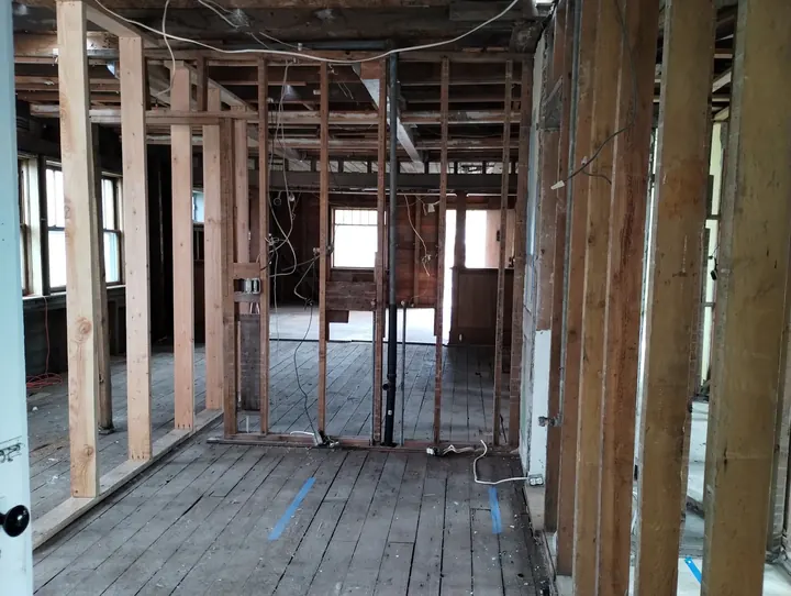 Interior taken down to the studs and floor joists during fire restoration