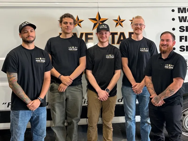 Five Star Disaster Services mitigation crew in front of a company van